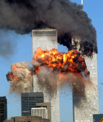 NEW YORK - SEPTEMBER 11, 2001:  (FILE PHOTO) A fiery blasts rocks the south tower of the World Trade Center as the hijacked United Airlines Flight 175 from Boston crashes into the building September 11, 2001 in New York City. Almost two years after the September 11 attack on the World Trade Center, the New York Port Authority is releasing transcripts on August 28, 2003 of emergency calls made from inside the twin towers.  (Photo by Spencer Platt/Getty Images)
