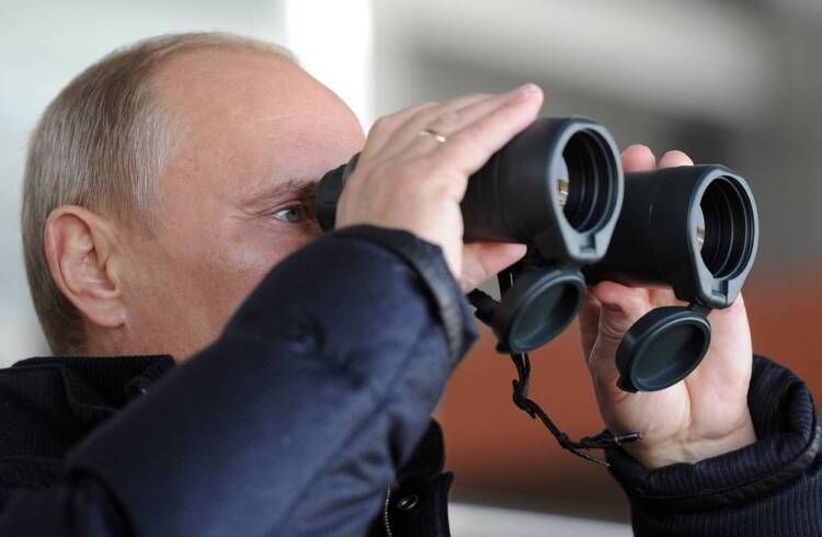 Putin watching Sarah and Todd Palin.